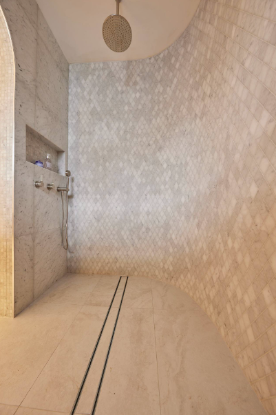 Curved shower with textured porcelain diamond tiles and linear drain – elegant 2025 bathroom design